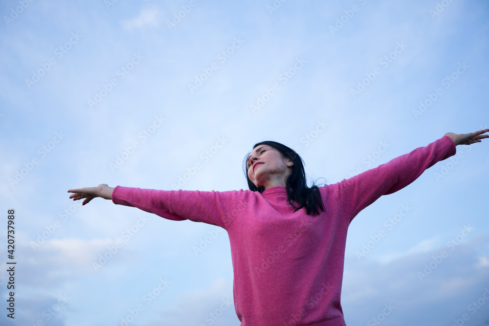 happy young woman enjoying freedom with open hands happy young woman enjoying freedom with open hands