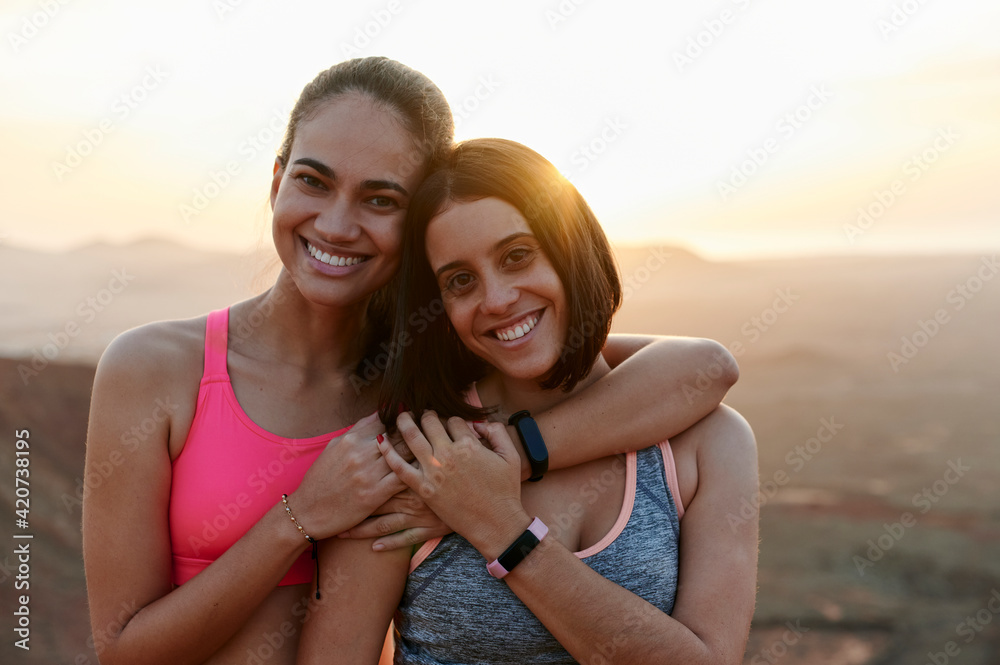 Smiling women ready for a late afternoon trial run Smiling women ready for a late afternoon trial run