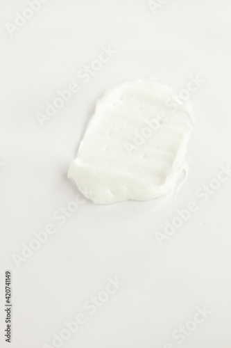 White face body hand legs cream smashed on white, cosmetic texture, skin care, facial treatment cosmetics 