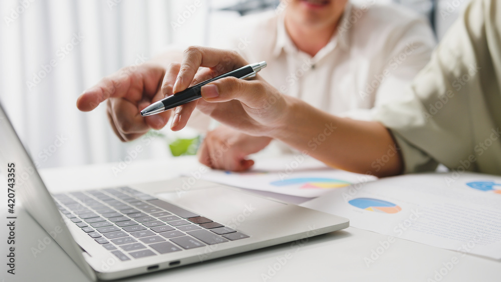Collaborative process of multicultural businesspeople using laptop presentation and communication meeting brainstorming ideas about new project colleagues working plan success strategy in home office.