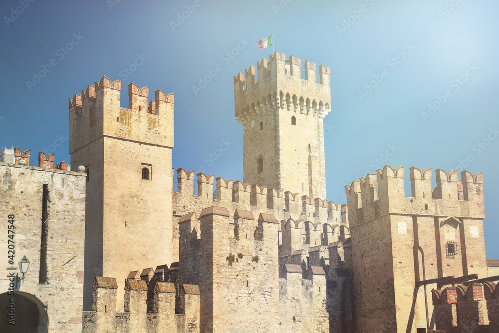 italian castle, ancient architecture in Italy with a flag on the top