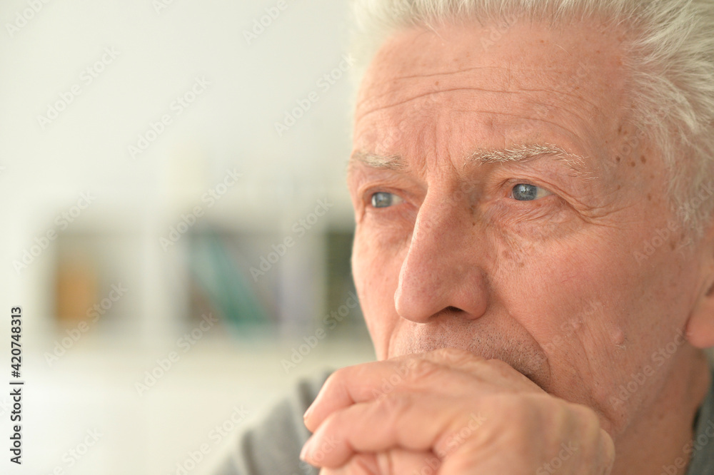 portrait of thoughtful senior man portrait of thoughtful senior man
