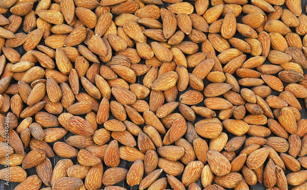 Organic almond nuts as background, top view. Healthy snack Organic almond nuts as background, top view. Healthy snack