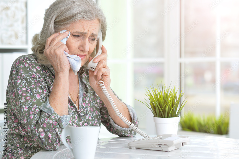 Portrait of ill senior woman calling doctor Portrait of ill senior woman calling doctor
