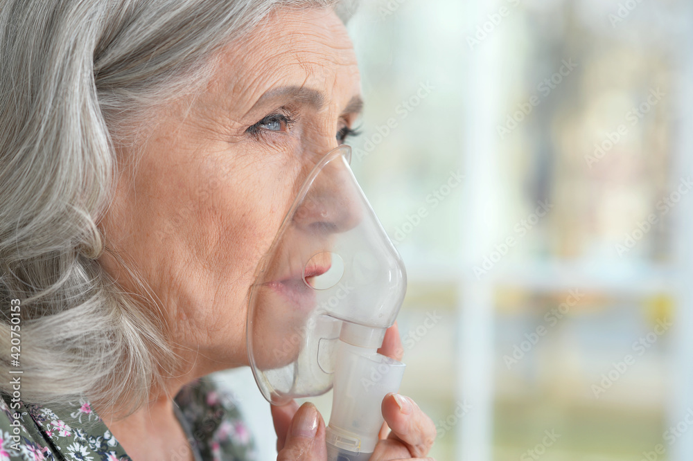 Portrait of elderly woman with flu inhalation Portrait of elderly woman with flu inhalation