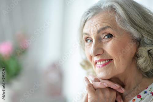 portrait of happy senior woman at home