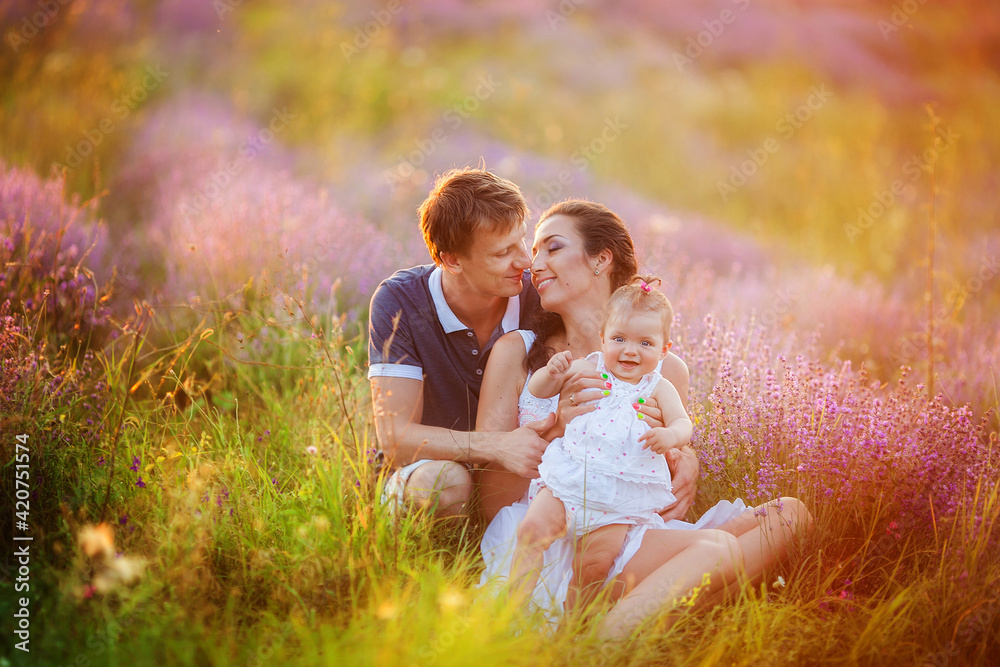 Fototapeta premium Happy young family with children having fun outdoors.