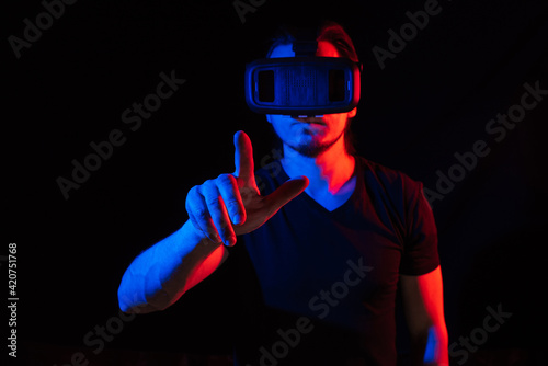 A young man using high-tech virtual reality glasses © Anastasia