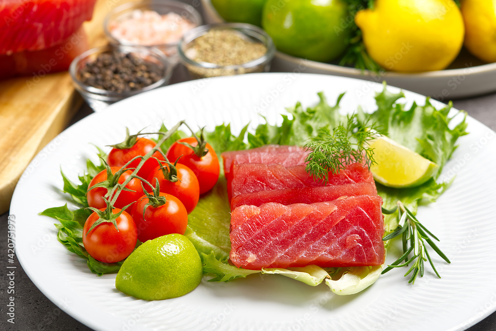 tuna sushi, Tuna carpaccio, tuna sashimi with vegetables. healthy eating with seafood, we cook at home tuna sushi, Tuna carpaccio, tuna sashimi with vegetables. healthy eating with seafood, we cook at home