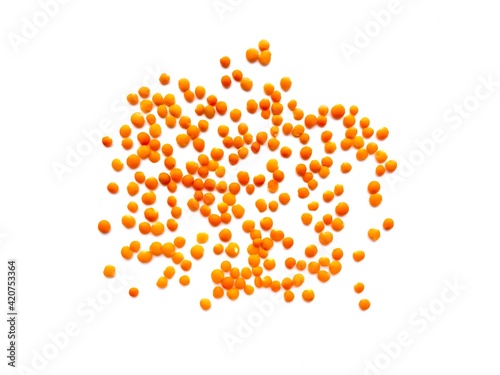 Red lentils isolated on white background.  A source of protein in vegetarian diets.