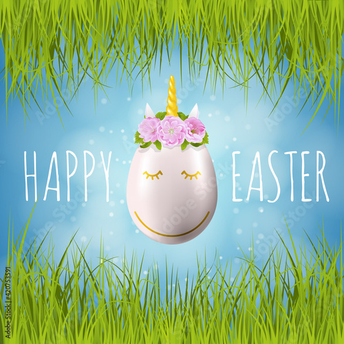 Happy easter greeting card with unicorn horn egg, almond flowers, green grass and blue sky. Animal egg