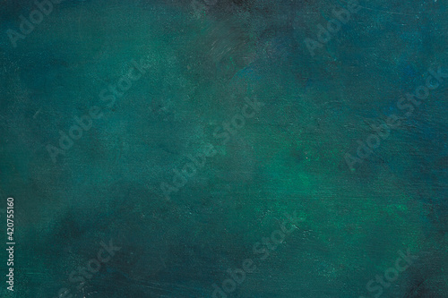 Colorful dark blue-green painted wooden board. Abstract background. Flat lay.