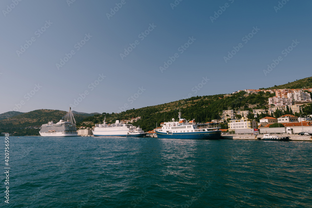 Cruise ships moored in the port of Gruz in Dubrovnik, near the bridge.