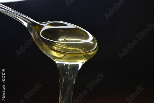 olive oil in a spoon