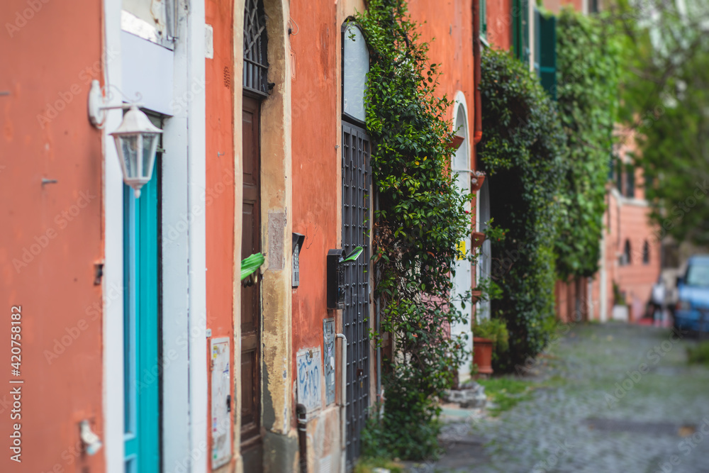 Fototapeta premium Trastevere district, Rome, Italy, view of rione Trastevere, Roma, with historical narrow streets, Municipio I, west bank of Tiber in Rome, Lazio, Italy, cozy streets with restaurants and architecture
