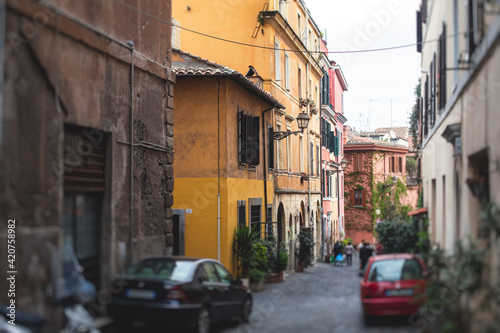 Trastevere district, Rome, Italy, view of rione Trastevere, Roma, with historical narrow streets, Municipio I, west bank of Tiber in Rome, Lazio, Italy, cozy streets with restaurants and architecture © tsuguliev