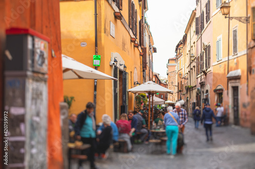 Trastevere district  Rome  Italy  view of rione Trastevere  Roma  with historical narrow streets  Municipio I  west bank of Tiber in Rome  Lazio  Italy  cozy streets with restaurants and architecture