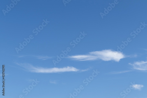 Bright blue sky with clouds, nature and environmental background © suththirat