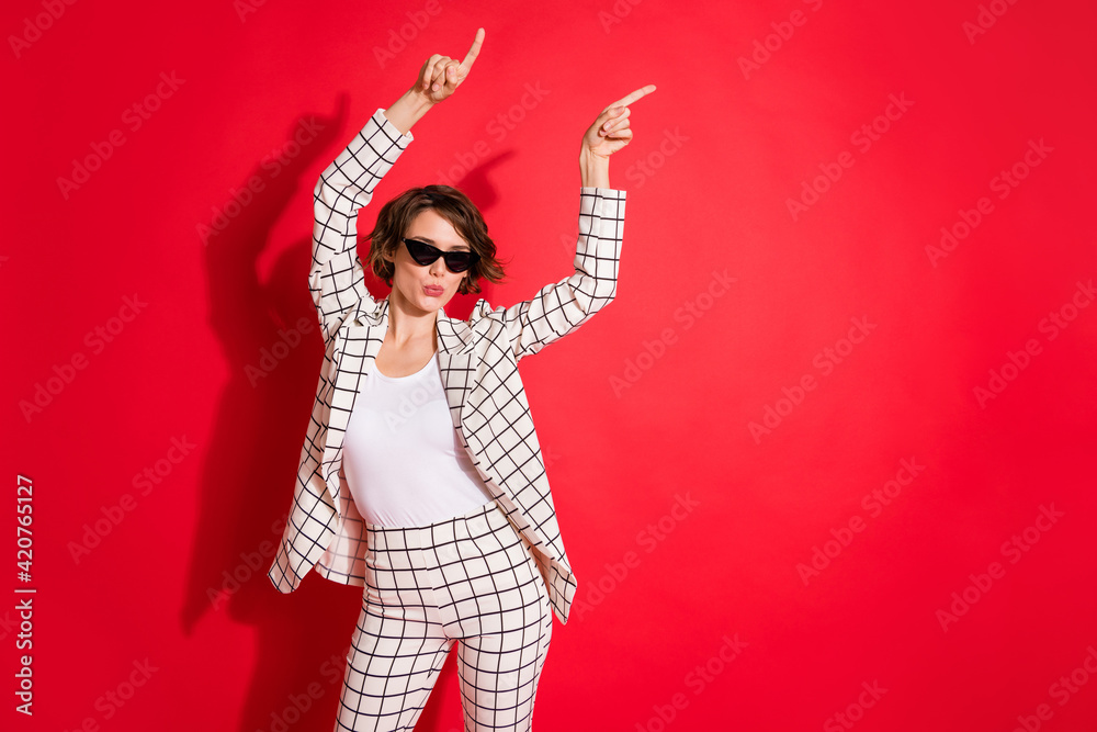 Photo of young attractive girl have fun enjoy pouted lips dance party isolated over red color background