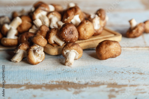 .Fresh shiitake mushrooms on the wooden kitchen table