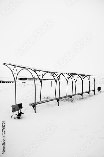 black and white noisy and fuzzy winter landscape shot on film, wild and deserted winter beach and embankment, the concept of minimalism and silence photo