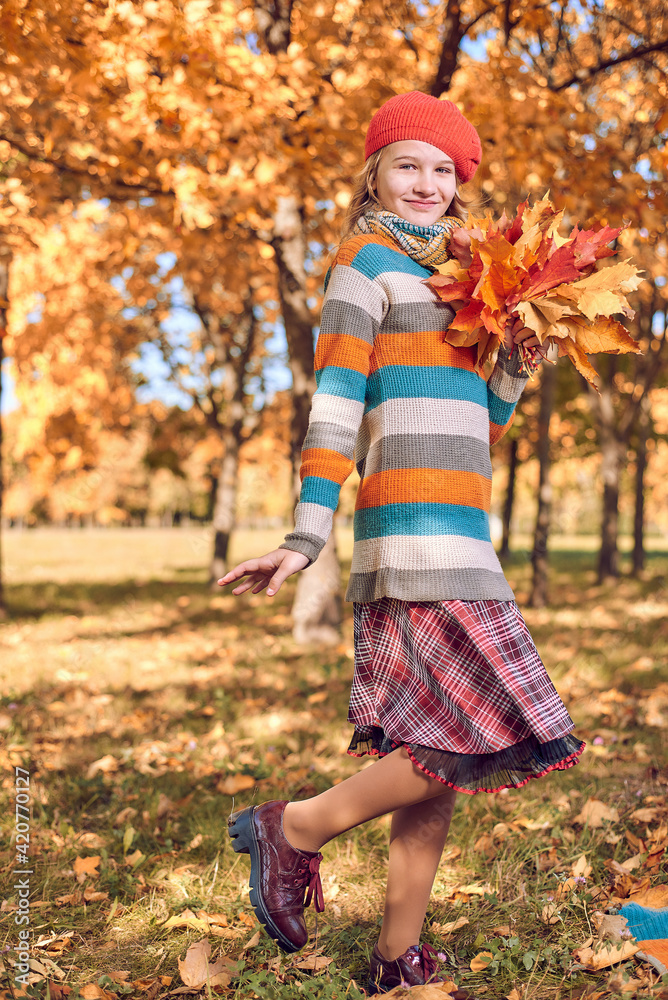 autumn portrait of young girl with bouquet of yellow orange foliage autumn portrait of young girl with bouquet of yellow orange foliage