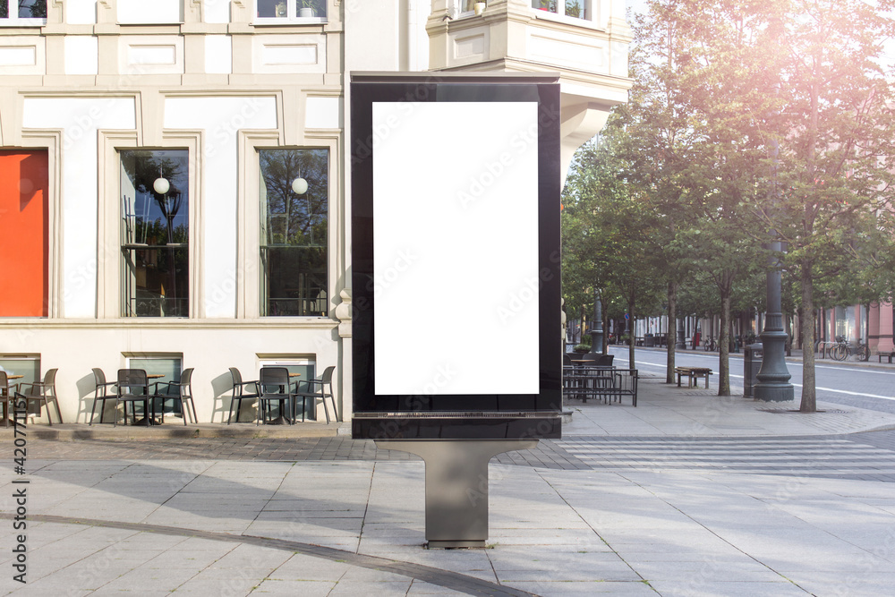 Mockup template of street lightbox stand signboard in the european city center. Mockup template of street lightbox stand signboard in the european city center.