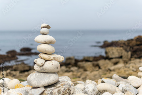 Zen rocks stacked near to the ocean