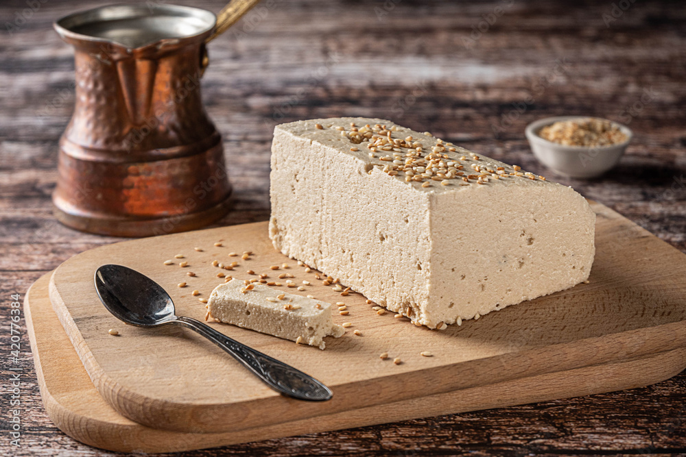 Tahini halva, with sesame seeds as its main ingredient, and a cezve on
