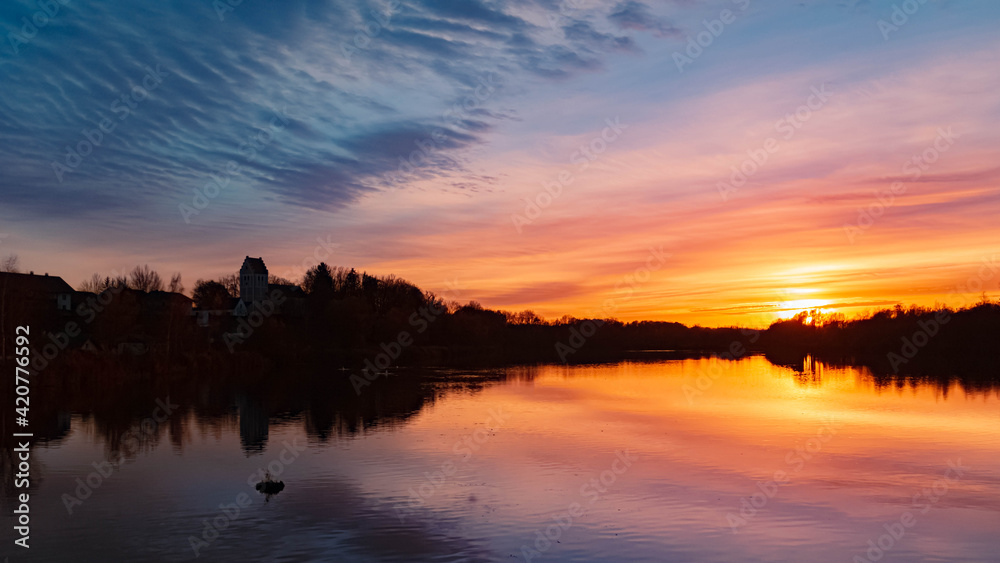 Beautiful sunset with reflections near Niederpoering, Isar, Bavaria, Germany
