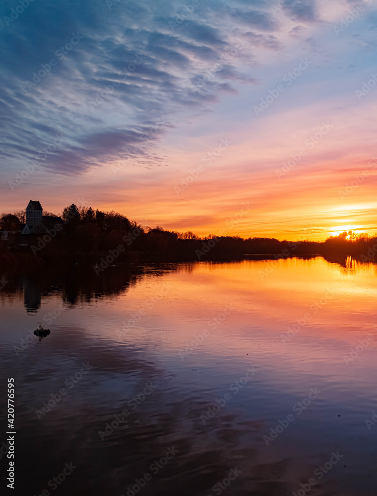 Beautiful sunset with reflections near Niederpoering, Isar, Bavaria, Germany