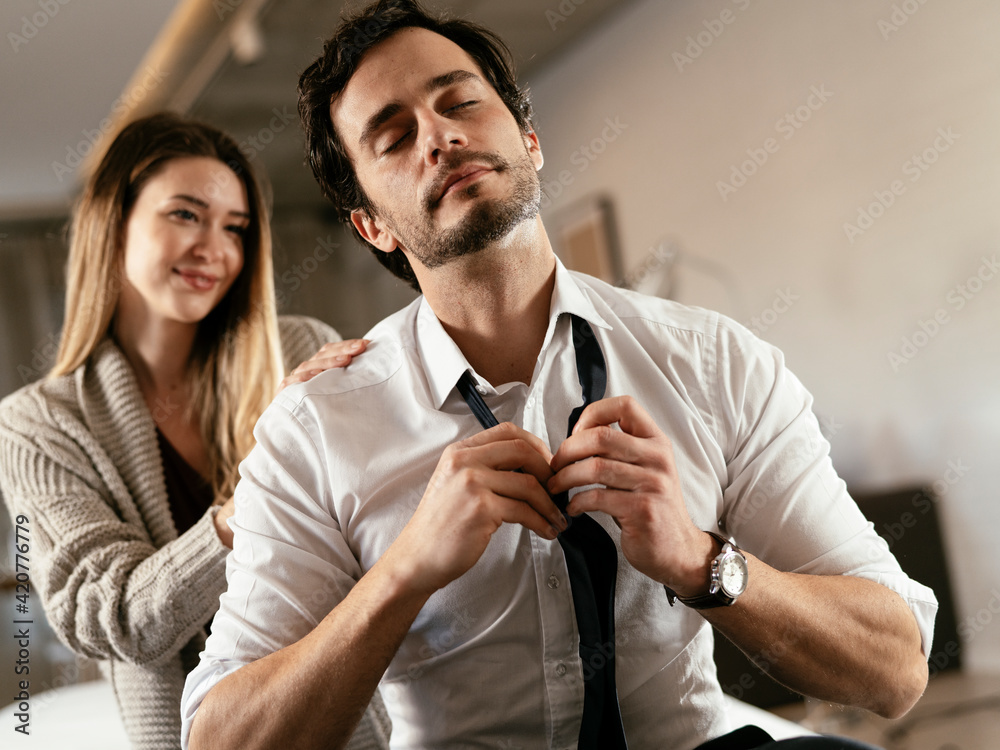 Young man having a problem. Girlfriend comforting her sad boyfriend.. Young man having a problem. Girlfriend comforting her sad boyfriend..