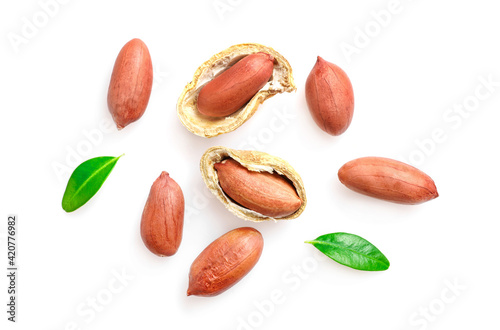 Unpeeled peanuts in nutshell isolated on white