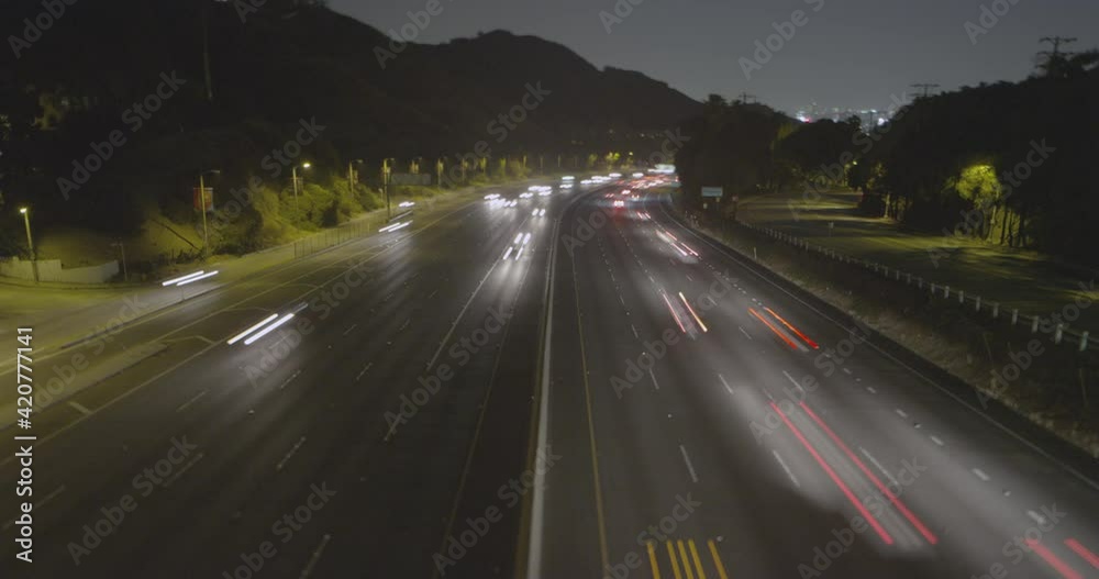 Timelapse of a highway near Los Angeles at night, cars leaving light streaks behind Timelapse of a highway near Los Angeles at night, cars leaving light streaks behind