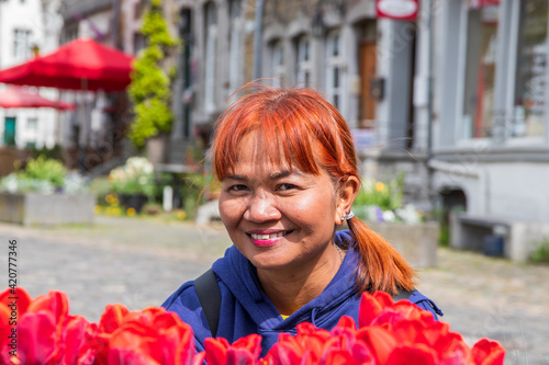 Thai Woman with red Hair in Kornelimünster near Aachen Germany Europe photo