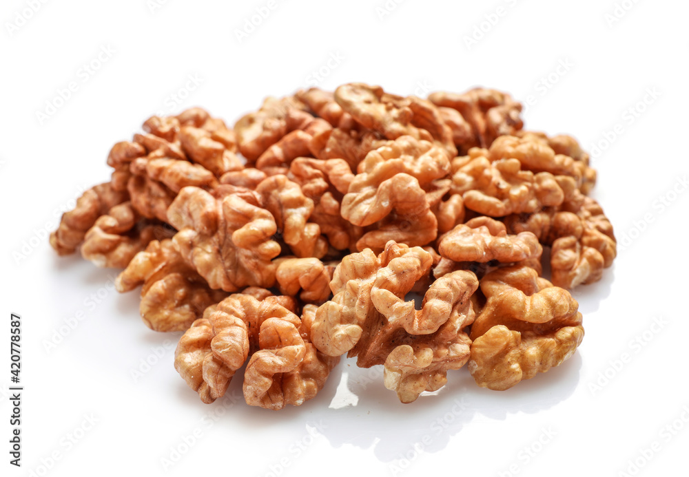 Golden nutritious walnut kernels isolated on white Golden nutritious walnut kernels isolated on white