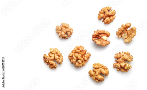 Golden nutritious walnut kernels isolated on white