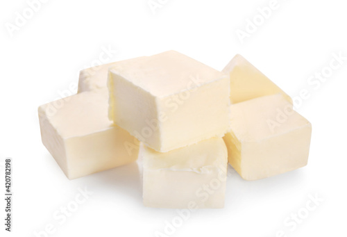 Pieces of fresh butter isolated on white background.