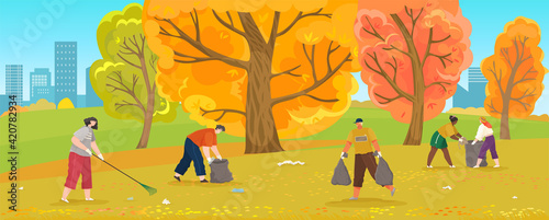People volunteering are throwing trash on autumn park polluted with plastic and paper waste