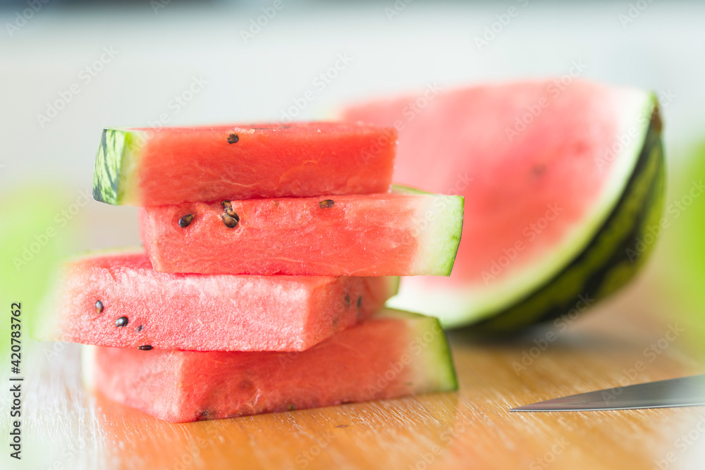 Slices of watermelon on a wooden table Slices of watermelon on a wooden table