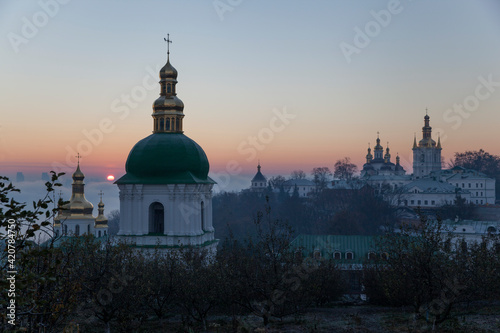 Kiev Pechersk Lavra monastery in Kiev, Ukraine. Orthodox church in the morning fog at dawn