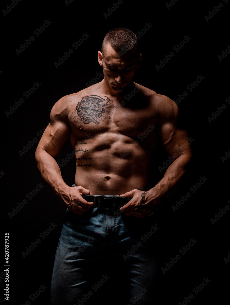 Fototapeta premium Bodybuilder posing in studio