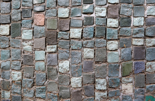 mosaic surface with small tiles in different tones- closeup texture