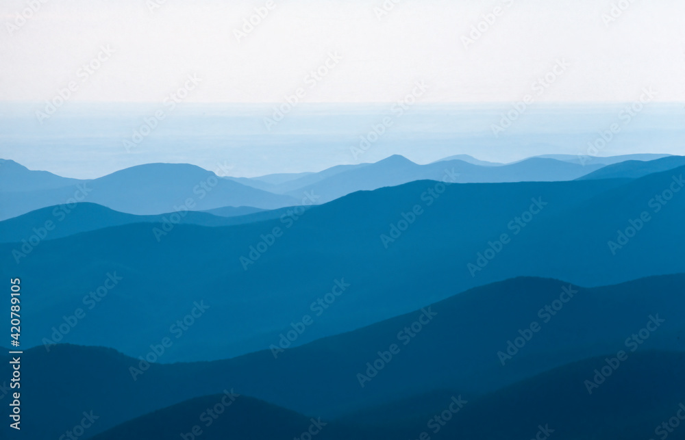 Blue mountain silhouettes in backlight, USA