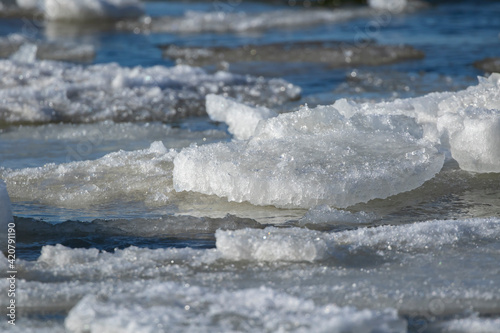 Melting ice by the sea during warm spring weather in Estonian nature