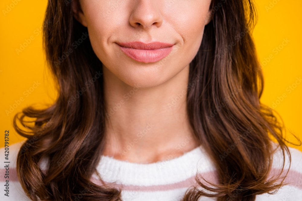 Cropped close-up view portrait of attractive cheerful girl isolated over bright yellow color background Cropped close-up view portrait of attractive cheerful girl isolated over bright yellow color background