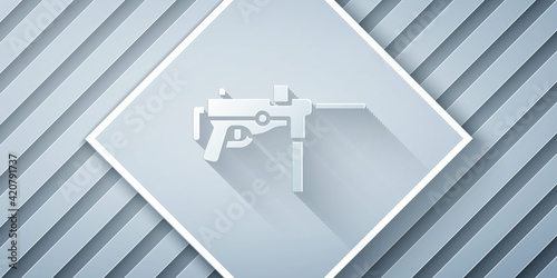 Paper cut Submachine gun M3, Grease gun icon isolated on grey background. Paper art style. Vector