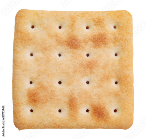 A single crisp fried cracker is isolated on a white background.
