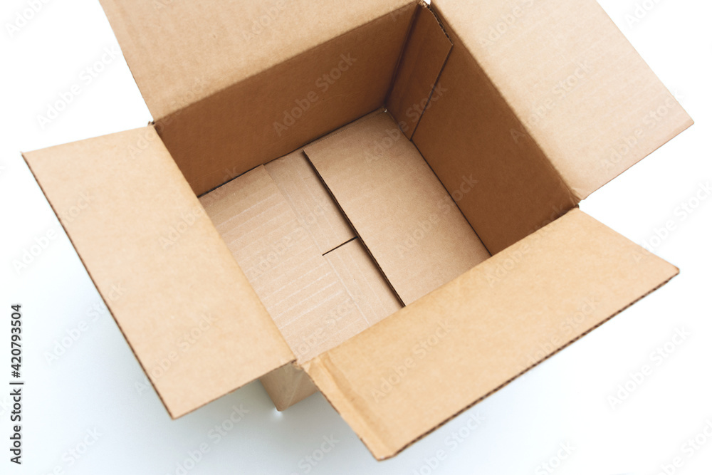 Opened empty cardboard box on a white background, cropped image, top view Opened empty cardboard box on a white background, cropped image, top view
