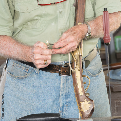 Vintage black powder rifles at a rifle range.